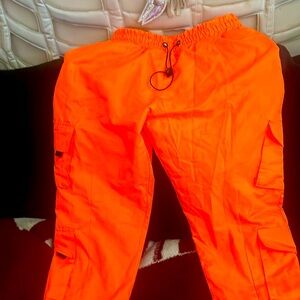 Boohoo man cargo neon pants orange, size 34, trim with black.